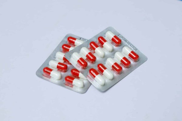 red and white medication pill blister pack